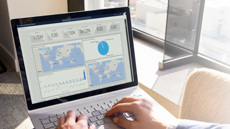 Illustration of charts and reports on a laptop screen.