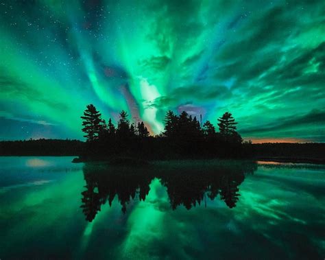 Northern Lights Aurora Borealis Over Lake In Minnesota Boundary