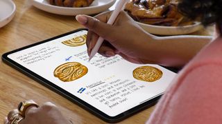 An image of someone handwriting on an iPad using an Apple Pencil and the Apple Smart Script function to refine handwriting on iPad