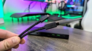 The Razer USB4 Dock's USB Type-C 4.0 to USB Type-C 4.0 braided cable, with the Razer USB4 Dock in the background.