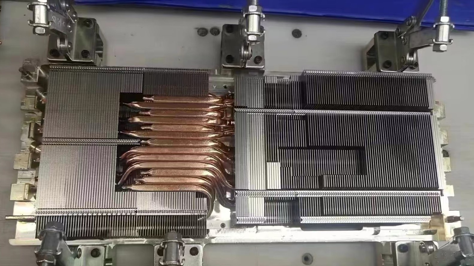 Heat sink of suspected Lenovo Legion RTX 4090 graphics card, showing copper heat pipes underneath.