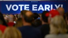 A sign urging early voting is displayed at a Trump campaign rally in Erie, Pennsylvania on September 29, 2024 