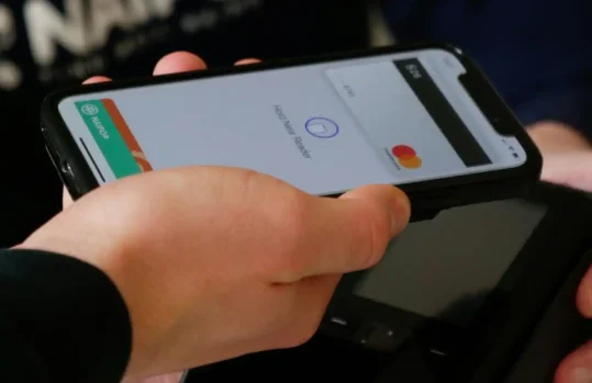 user making a mobile payment with a phone