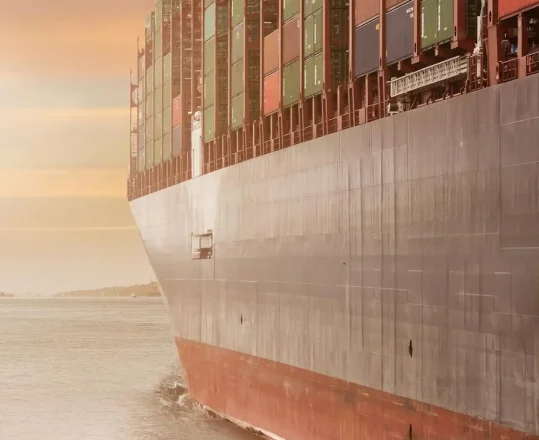 the hull of a gray cargo ship