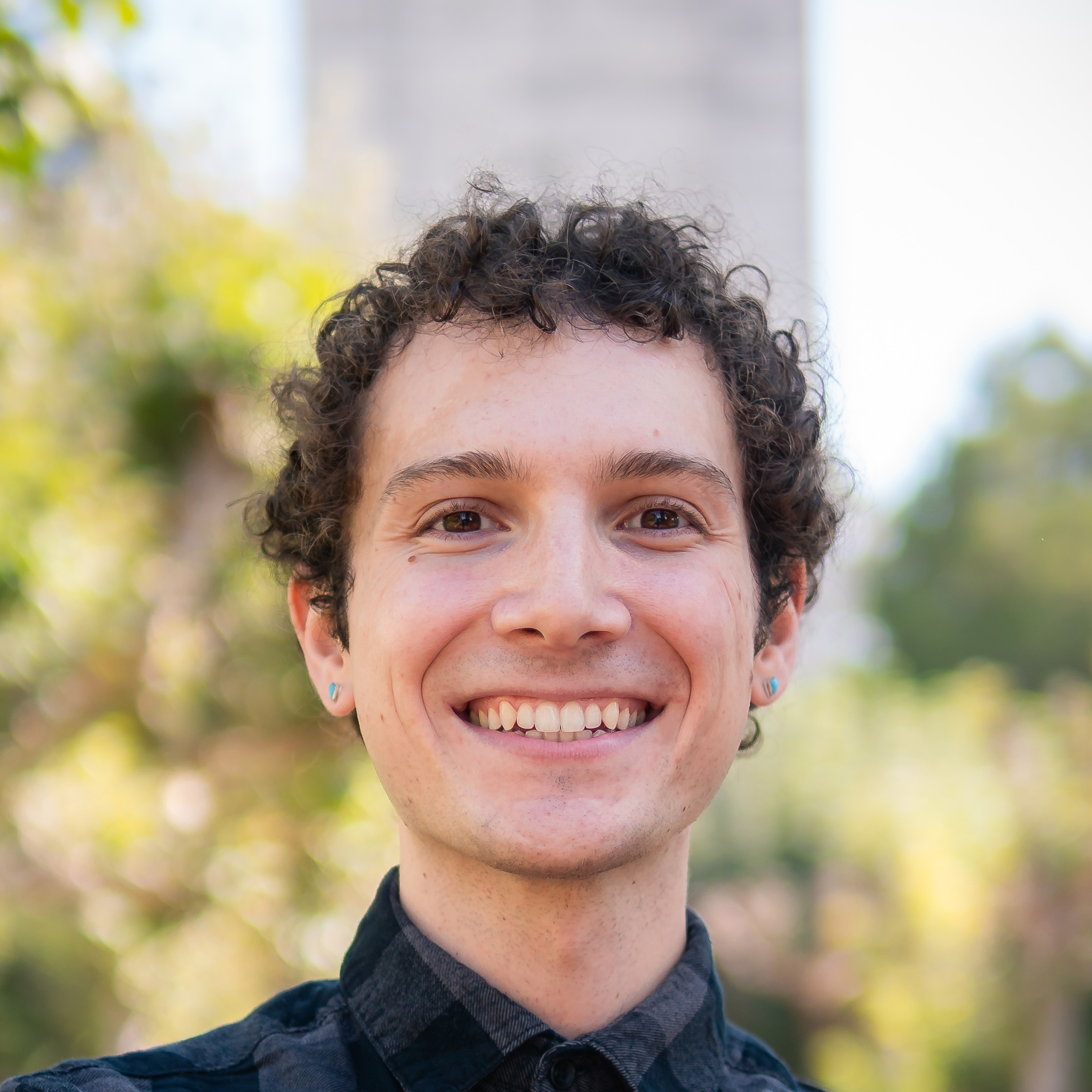 A close-up photo of Justin Lubin smiling.