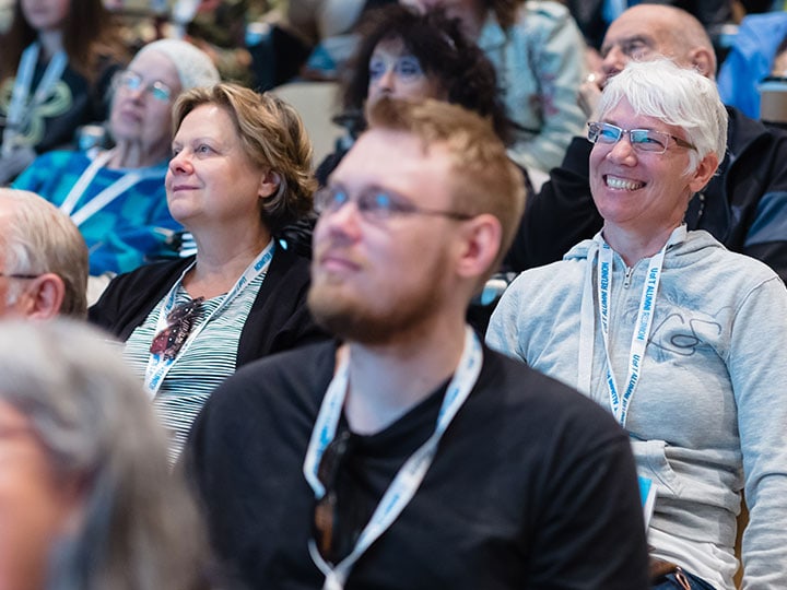 An image of the audience in a lecture theatre, laughing: the image is next to the alumni events link.