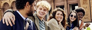 Group of multi-ethnic young people having fun outside