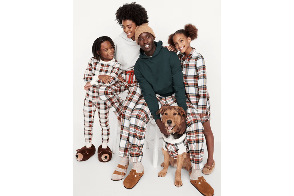 family in plaid matching Christmas pajamas