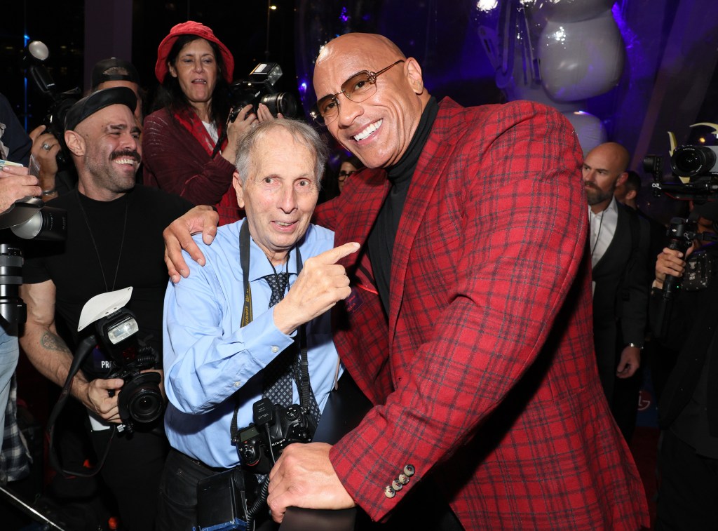 Dwayne Johnson and George Napolitano posing together at the "Red One" premiere in New York City