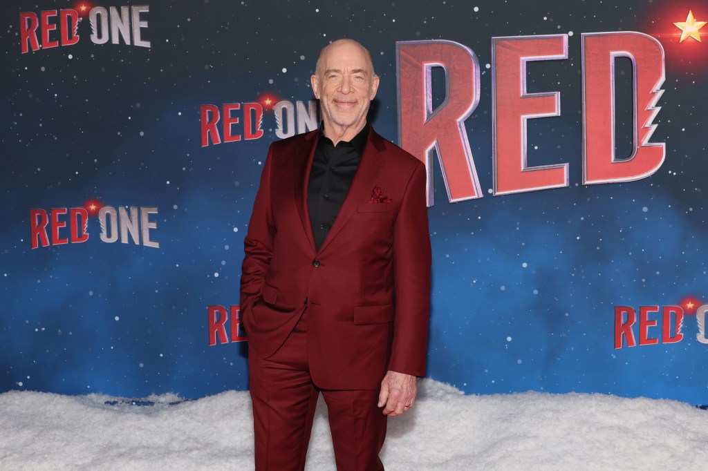 Actor J. K. Simmons in a red suit attending the New York premiere of Amazon MGM Studios' 'Red One' at Alice Tully Hall, Lincoln Center