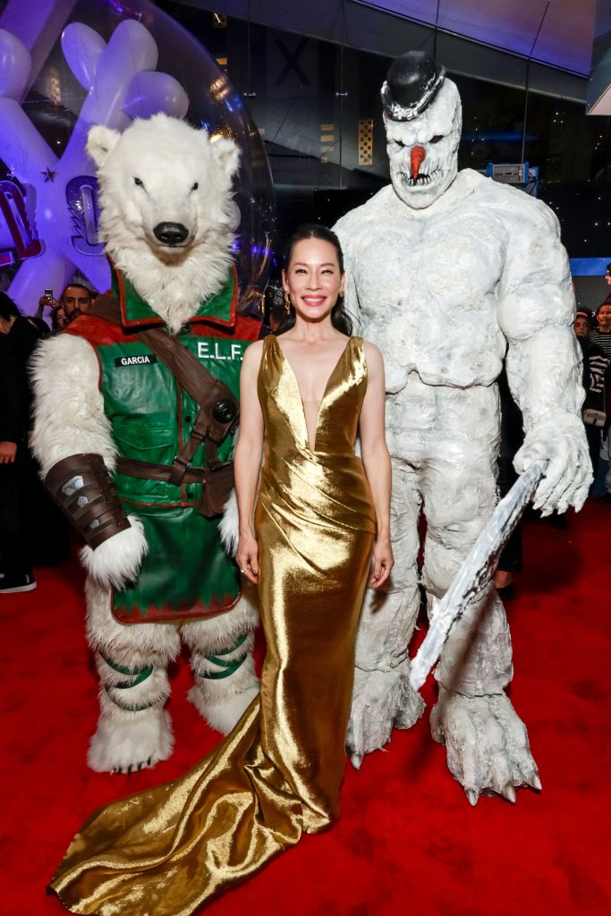 Lucy Liu in a gold dress at the AMAZON MGM Studios Red One US Premiere in Alice Tully Hall, New York City, on Nov 11, 2024