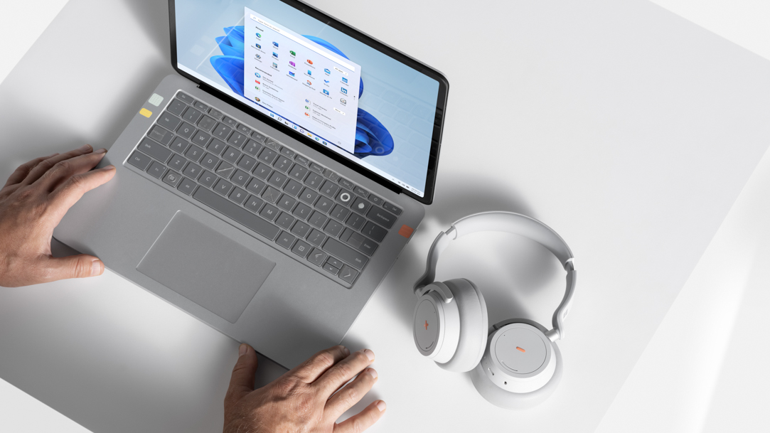 Two women collaborating on a Microsoft Surface laptop