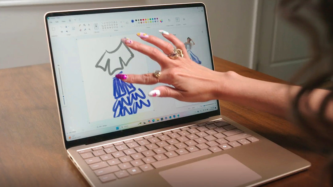 An image that shows the screen of a Surface Laptop and sketching a fashion idea in Microsoft Paint