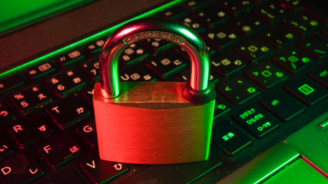 Brass lock on top of black keyboard