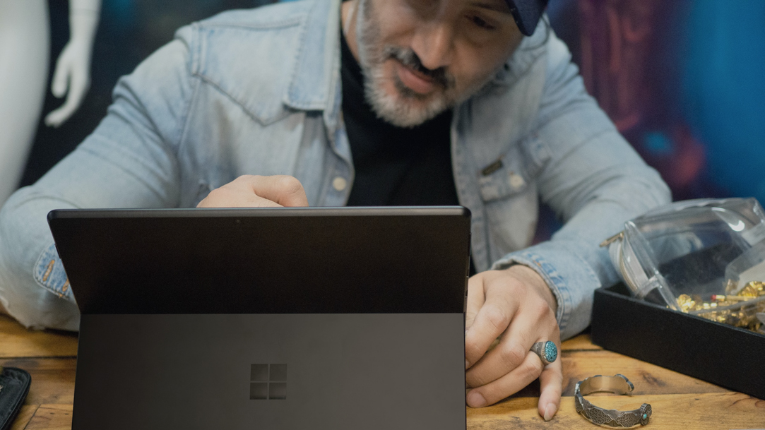 Man using Surface device and Pen