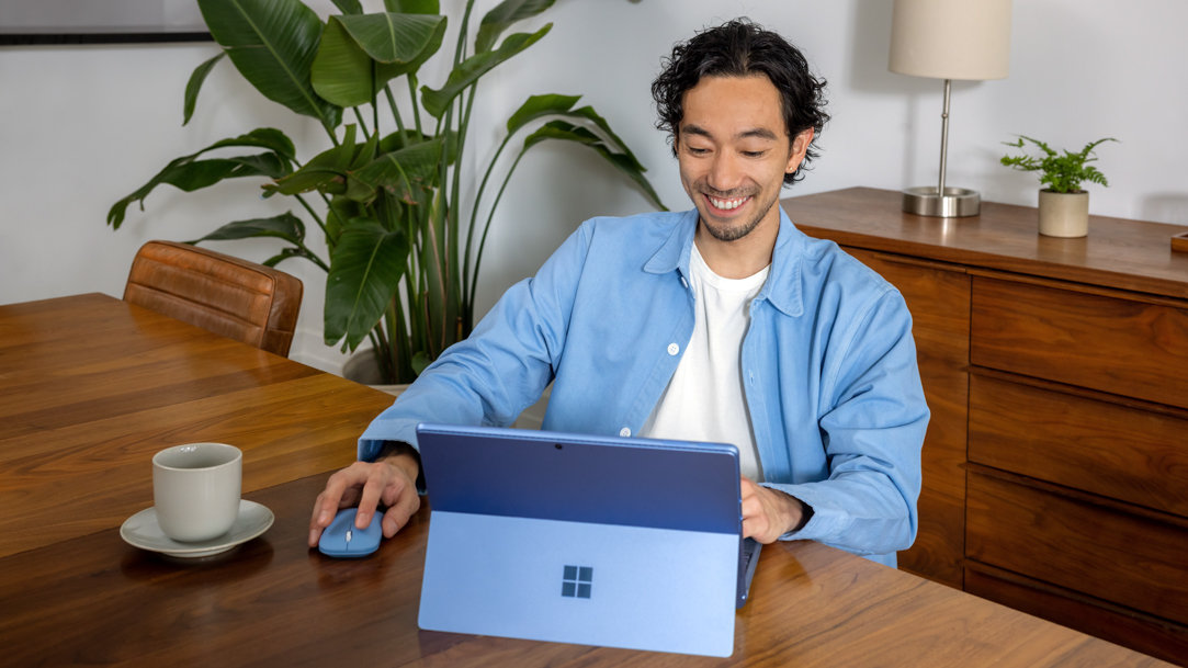 Man working on Microsoft Surface laptop