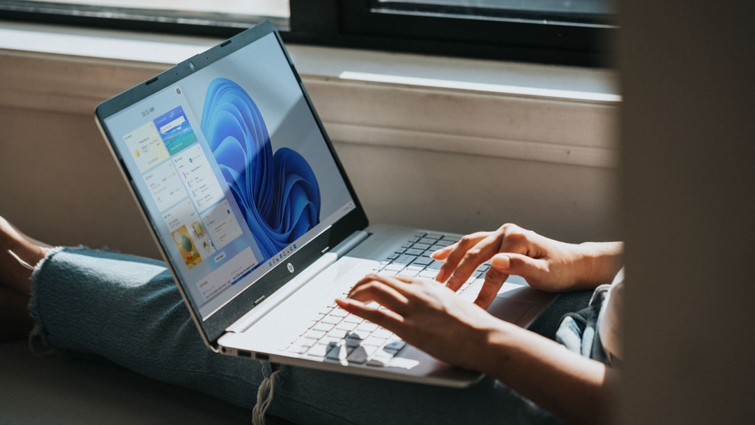 Person working on Windows 11 computer