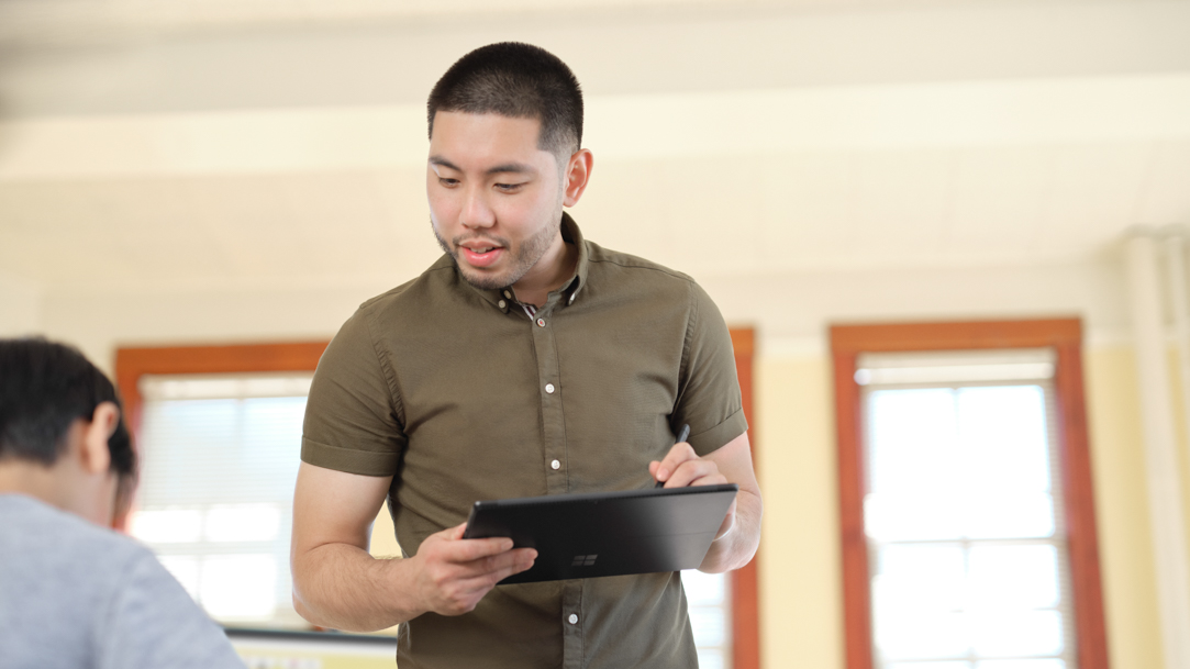 Teacher working with a Surface device