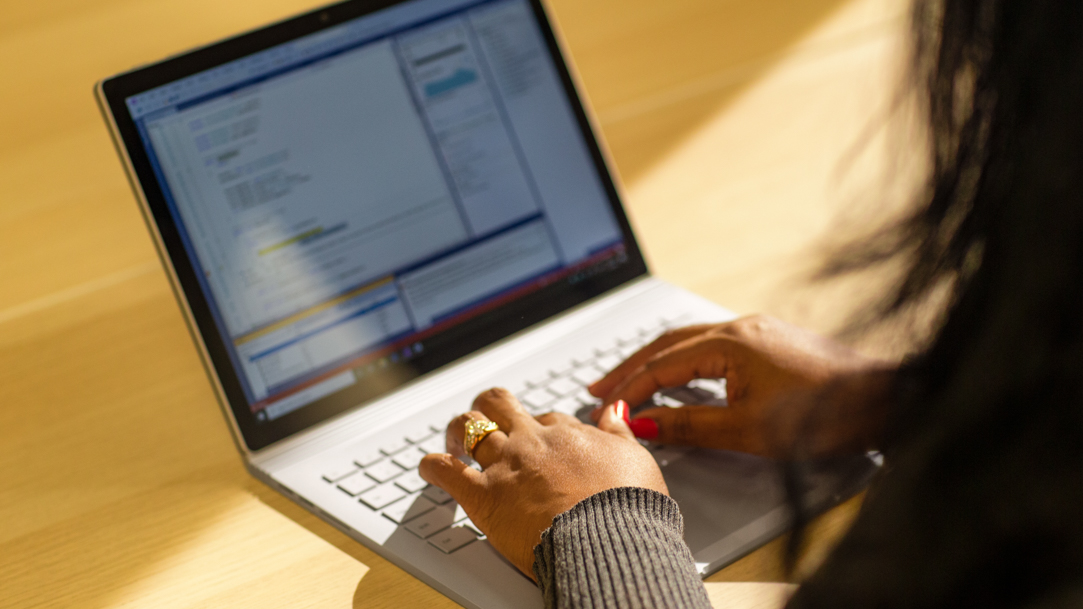 Woman opening laptop