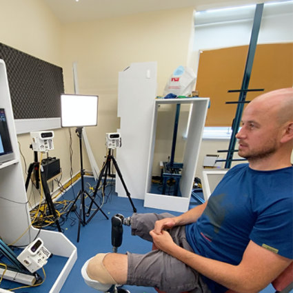 Man with biontic legs sitting down