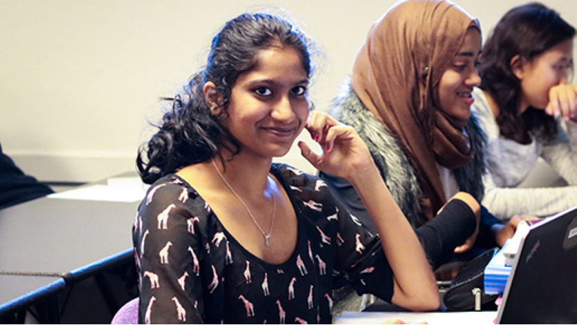 Female and minority high school students participating in a TEALS computer science class