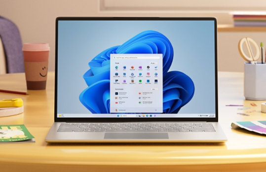 Computer sitting on a table with a Pinned and Recommended box on the screen