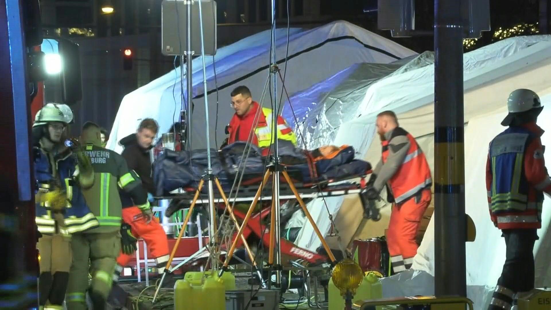 Rescue workers at scene of deadly car attack on German Christmas market