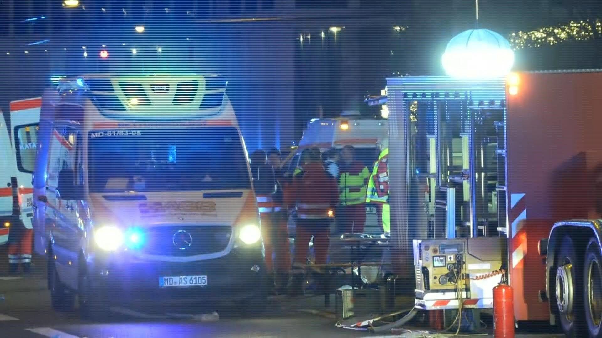 German rescue workers at the scene of a suspected car attack on Christmas market