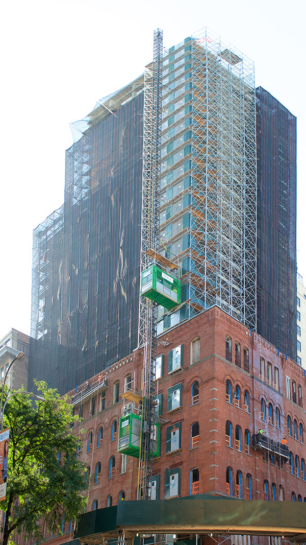 Completed Superstructure of 100 Vandam with the Existing Façade Below (Pavarini McGovern)