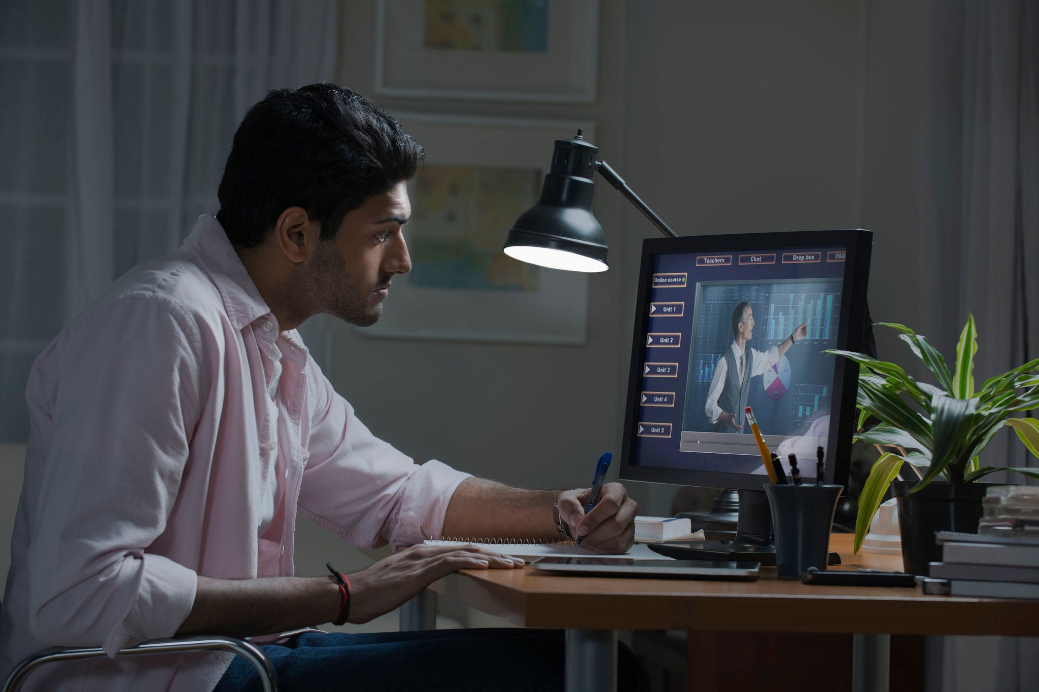 male student working at desk