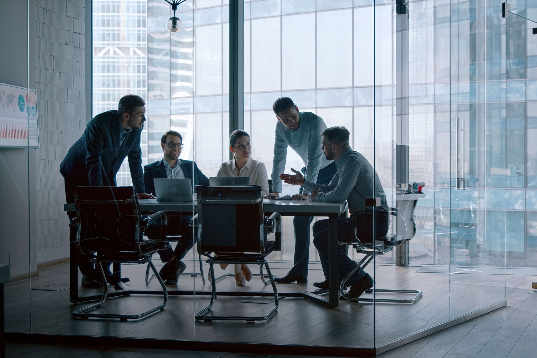 Young professionals having a discussion at a meeting in a modern office building