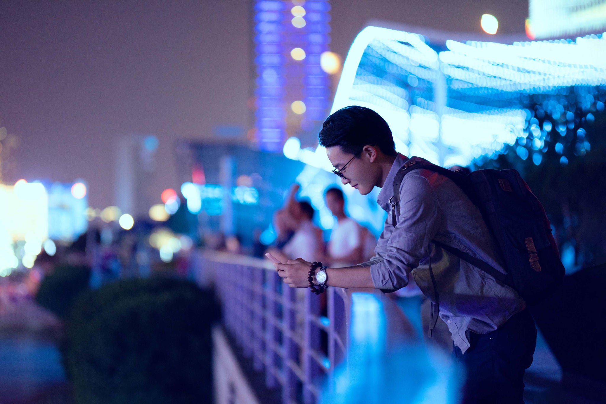 Young businessman looking at smartphone