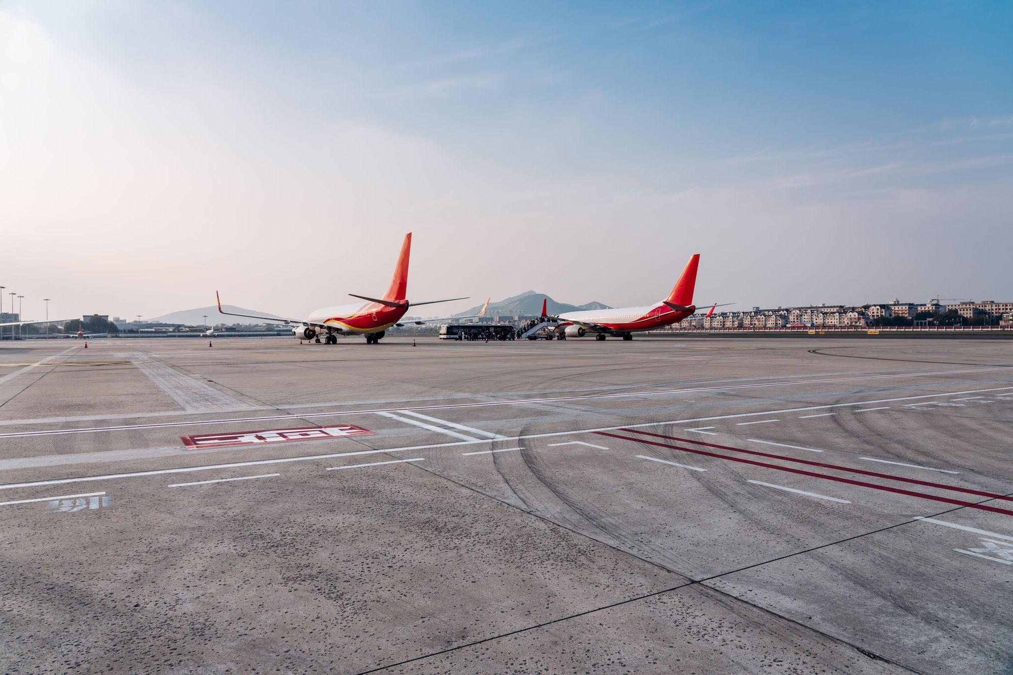 Airplane On Airport Runway Against Sky