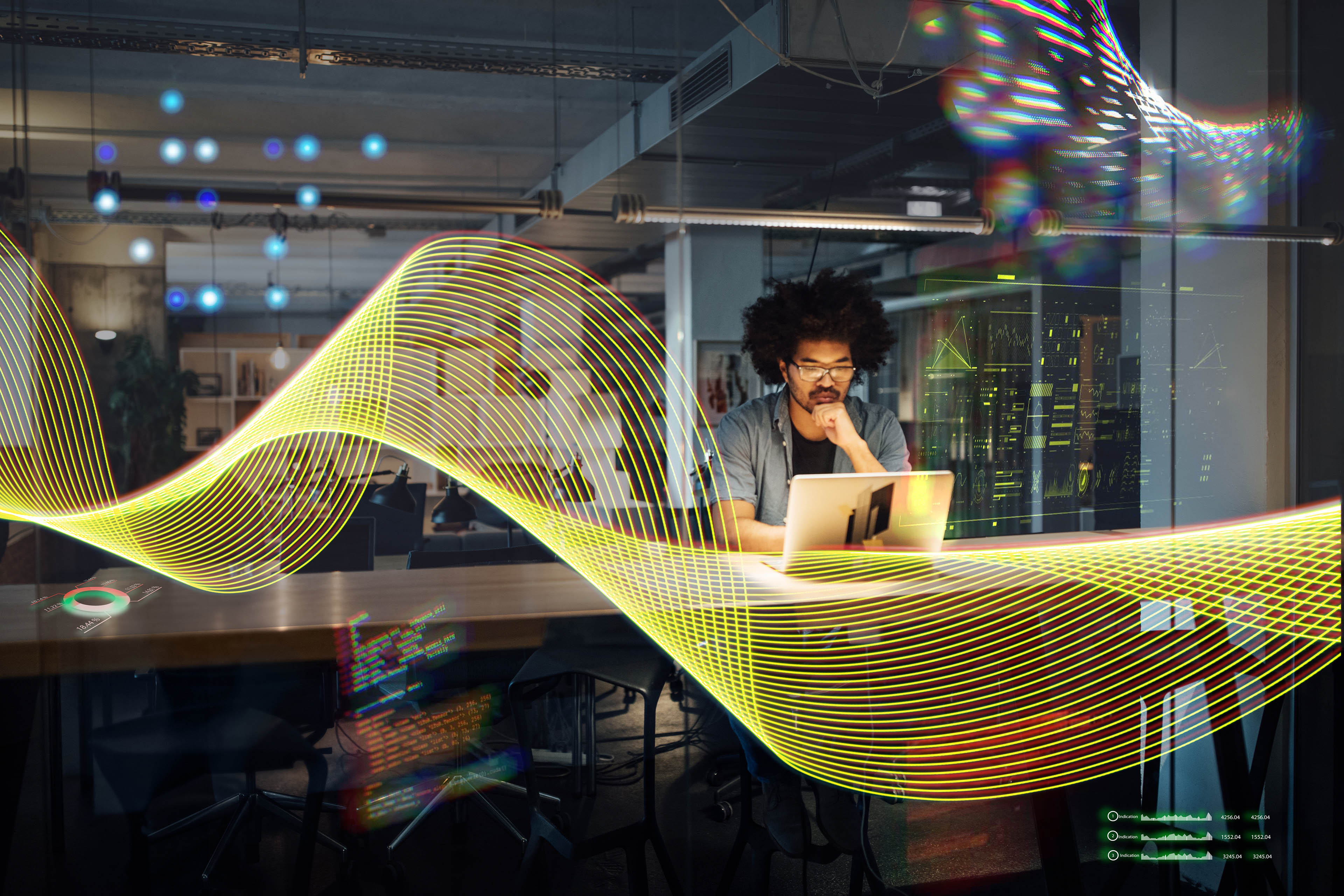 Serious businessman working on laptop