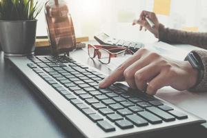 Close-up of person typing photo