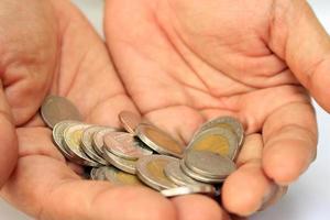 Coins in hands photo