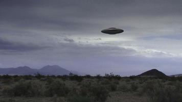 A UFO Hovers Over A Desert video