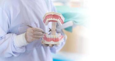 Female dentist standing in dentist office photo