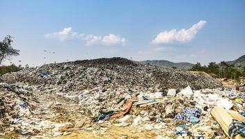 Polluted mountain large garbage pile and pollution photo