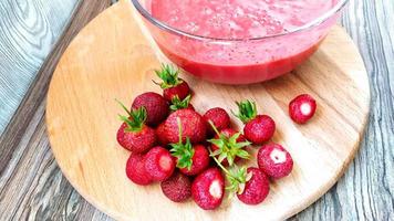 Glass cup with fruit and berry puree photo