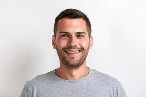 Closeup male studio portrait of happy man looking at the camera.- Image photo