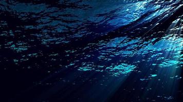 Underwater ocean waves ripple and flow with light rays - Loop video