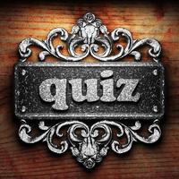 quiz word of iron on wooden background photo