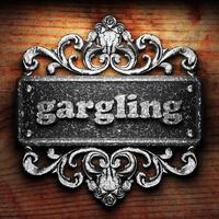 gargling word of iron on wooden background photo