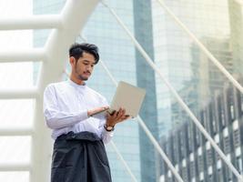 Young Burmese businessman find data in laptop ,It's time to talk about business photo