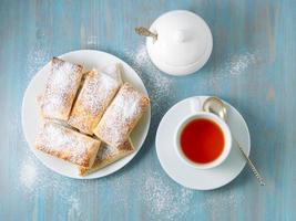 Delicious rolls from lush yeast-free puff pastry. Breakfast with cup of tea photo