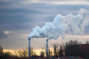 Smoke chimneys with polluting discharges photo