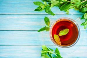 cup of black tea with fresh mint photo