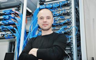 young it engeneer in datacenter server room photo