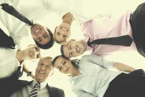 business people with their heads together photo